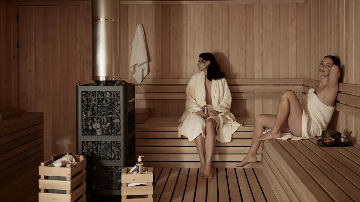 Warm cedar sauna interior with soft amber light
