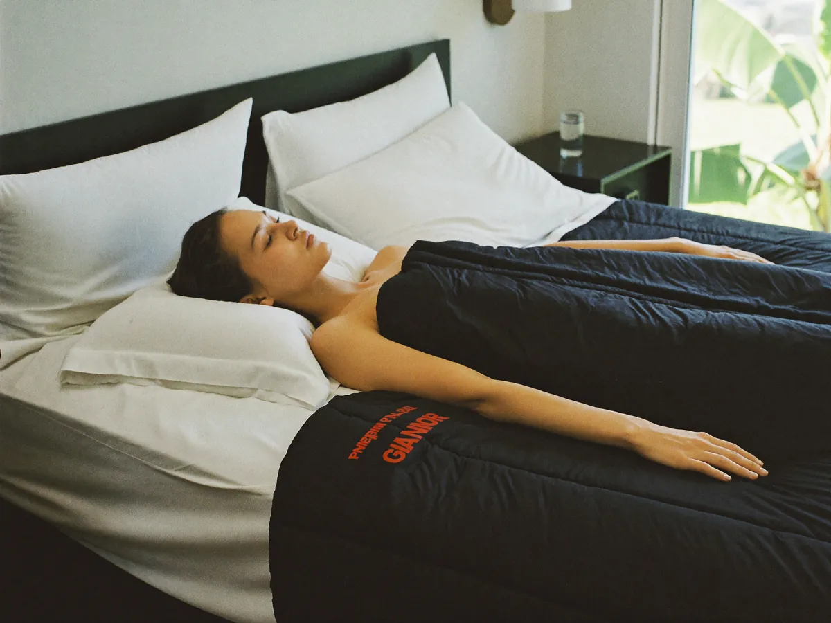 HigherDOSE Infrared Sauna Blanket in use with a client in a modern Indonesian wellness clinic