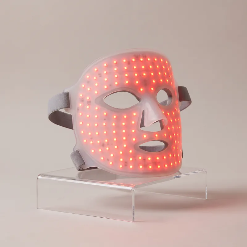 HigherDOSE red light therapy face mask glowing red